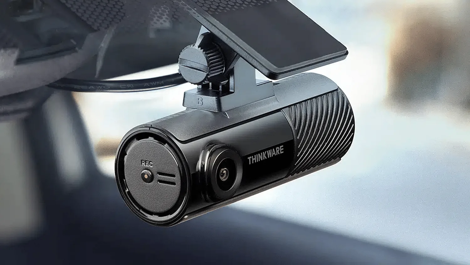 Thinkware F70 Pro dashcam mounted discreetly behind a car windscreen